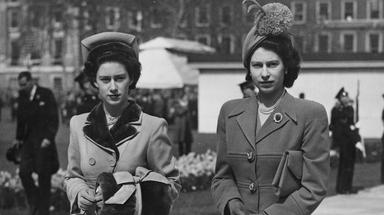 Princess Margaret and Queen Elizabeth II walking together 