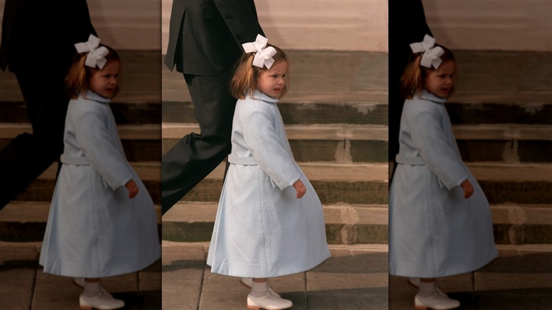 Young Princess Olympia of Greece walking up steps