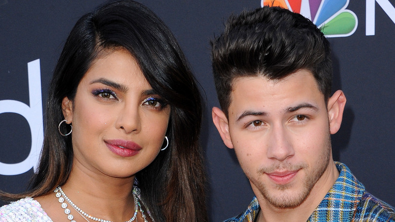 Priyanka Chopra and Nick Jonas pose for a picture at an event