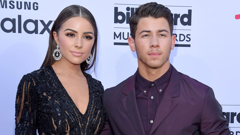 Nick Jonas and Olivia Culpo posing