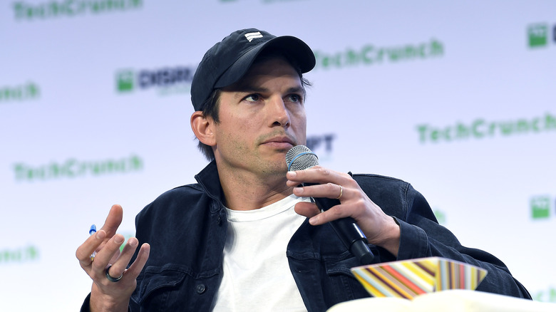 Ashton Kutcher speaking during an event