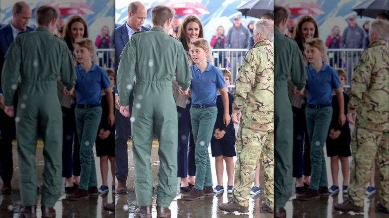 Prince George shaking hands