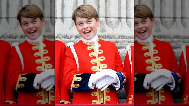 Prince George smiling in royal uniform 