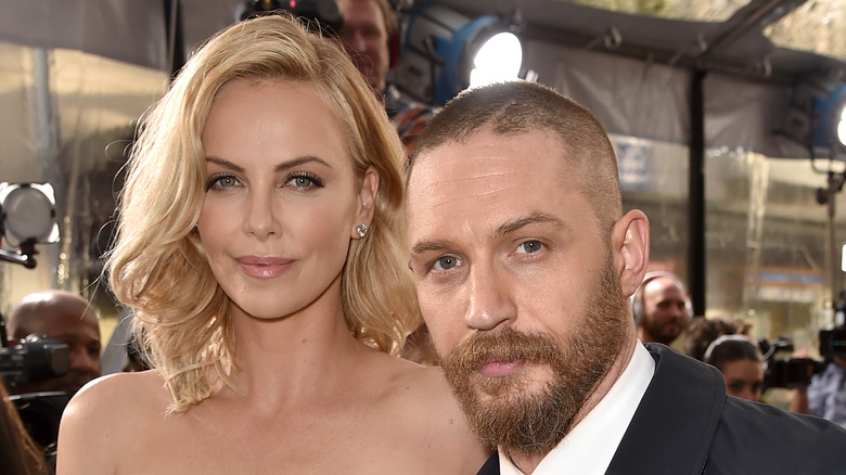 Charlize Theron and Tom Hardy pose on the red carpet together