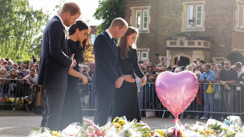 William, Harry, Kate and Meghan look flower tribute