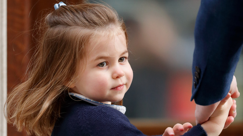 Princess Charlotte smiling on her way to school