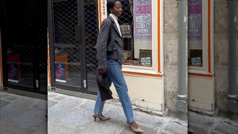 Woman wearing monogrammed pumps