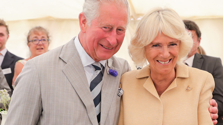 King Charles embraces queen consort Camilla