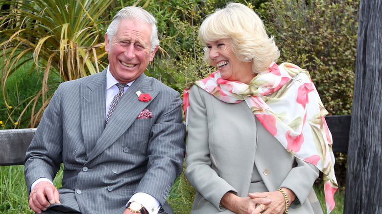 King Charles and queen consort Camilla laughing