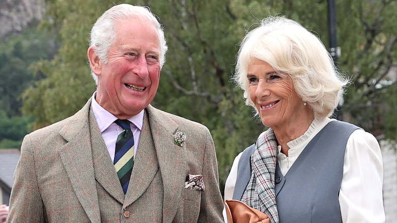 King Charles and Queen Camilla smiling