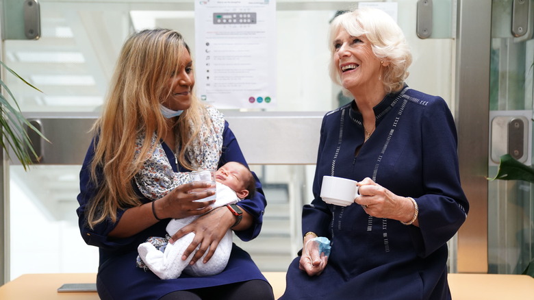 Queen Camilla meeting Shana Begum's three-week-old baby