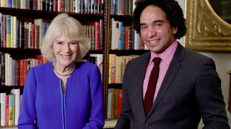 Queen Camilla and Joseph Coelho smiling