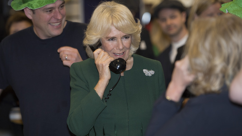 Queen Camilla phone smiling