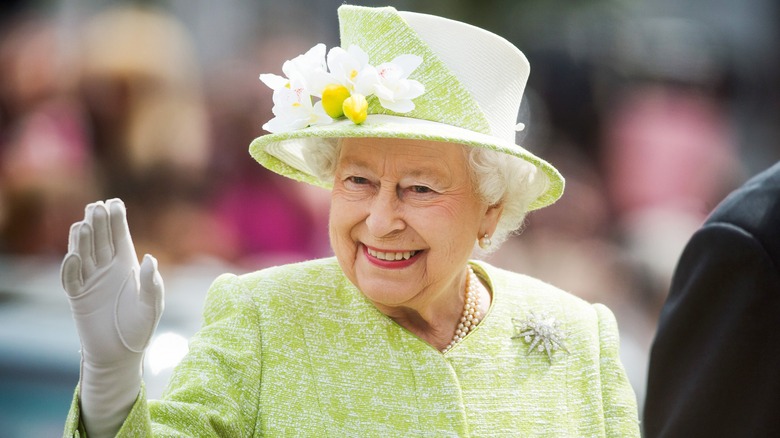 Queen Elizabeth II smiling waving