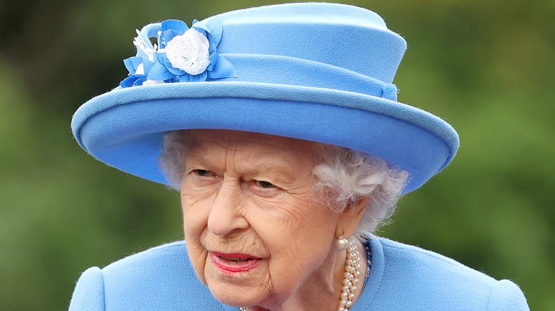 Queen Elizabeth in a blue hat