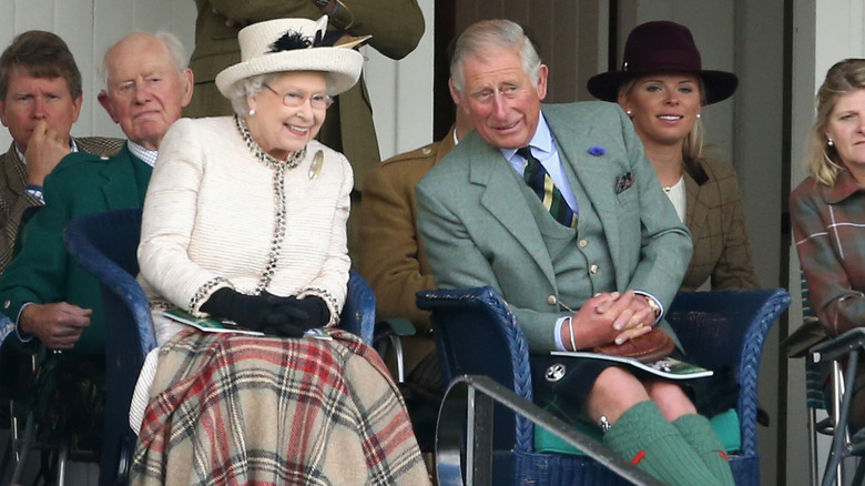 Queen Elizabeth and Prince Charles talking