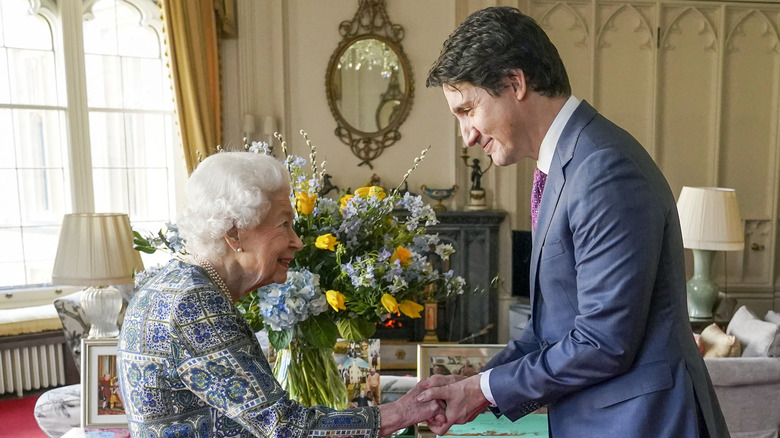 Queen Elizabeth shaking hands with Justin Trudeau