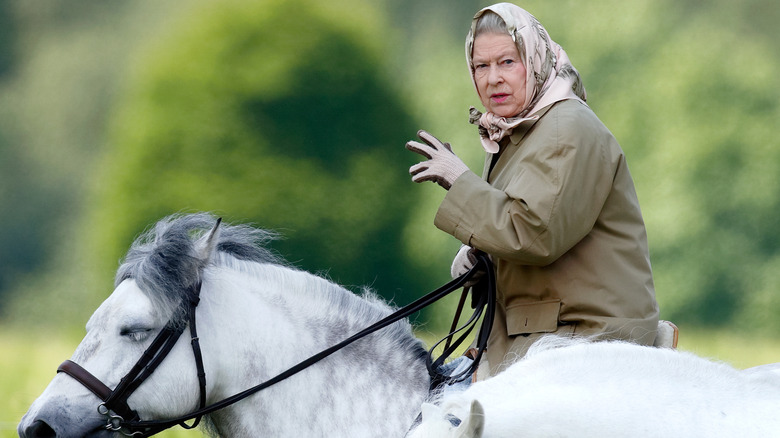 Queen Elizabeth riding a horse