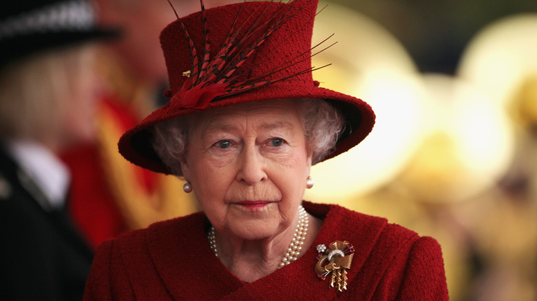 Queen Elizabeth looking radiant in red