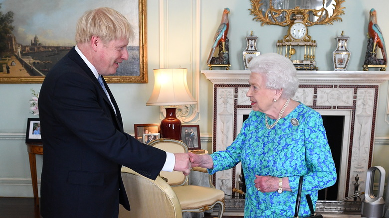 Boris Johnson and Queen Elizabeth shaking hands