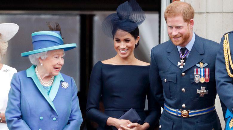 Queen Elizabeth, Meghan Markle, and Prince Harry