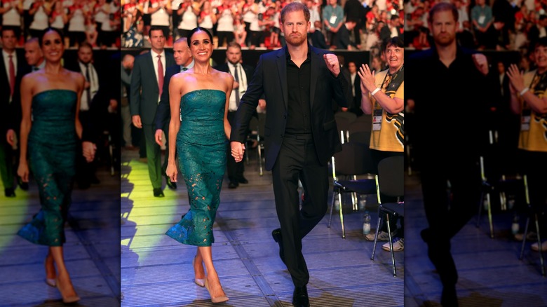 Meghan and Harry walking hand in hand in Dusseldorf 