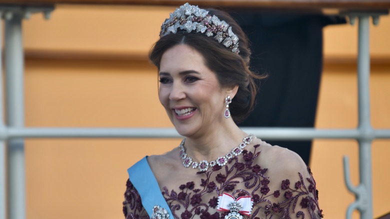 Queen Mary smiling in tiara and jewels