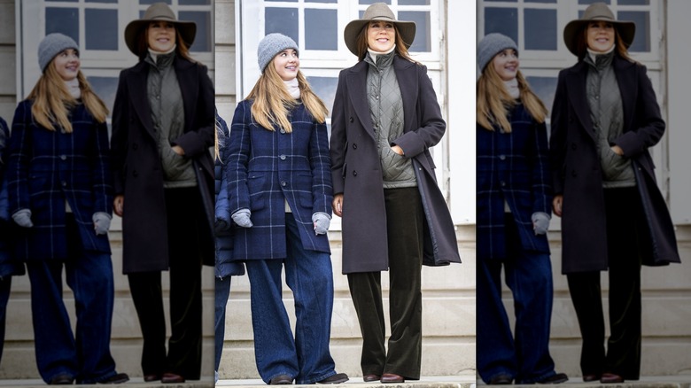 Princess Josephine of Denmark smiling up at her mother Queen Mary outside building