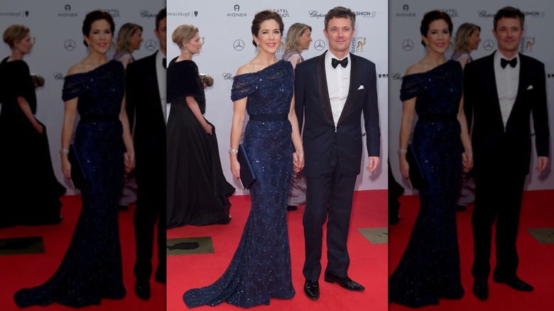 Princess Mary and Prince Frederik of Denmark posing on step-and-repeat