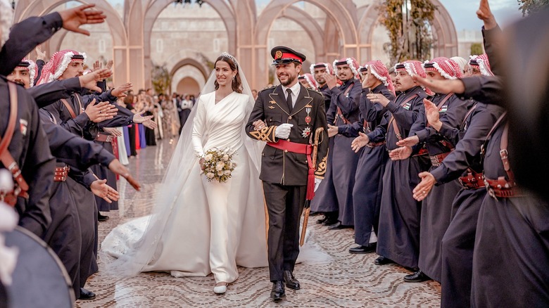 Prince Hussein walking through a crowd at his wedding