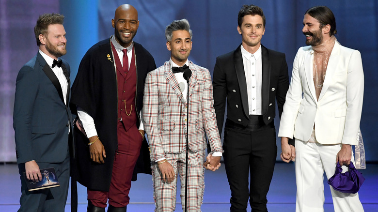 The cast of Queer Eye standing on stage at an award show