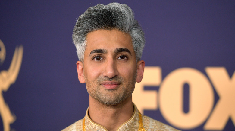 Queer Eye star Tan France poses on the red carpet