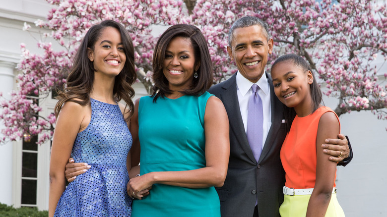 Sasha and Malia Obama with their parents