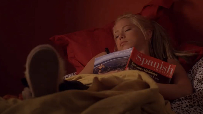 Dorinda sleeping with a book