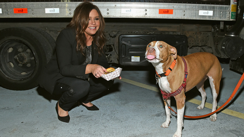 Rachael Ray smiling with her dog, Isaboo