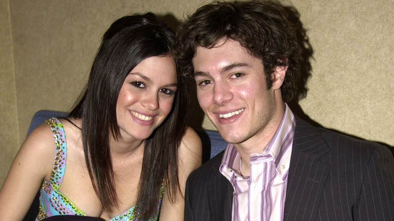 Rachel Bilson and Adam Brody heads together smiling