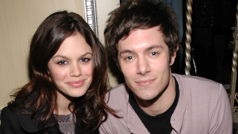 Rachel Bilson and Adam Brody smirking