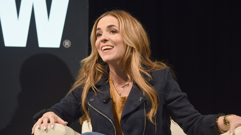 Rachel Hollis speaks at a conference