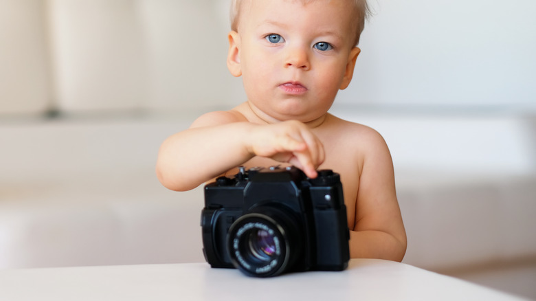 little boy with a camera