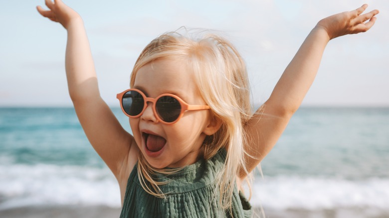 Blonde toddler in sunglasses