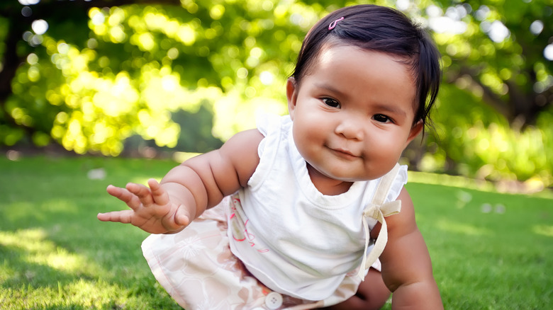 Baby playing in garden