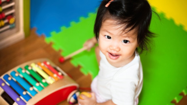 Baby playing xylophone