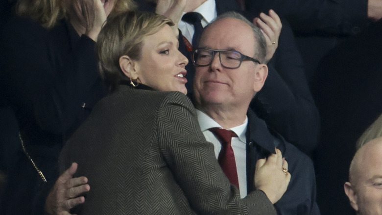 Princess Charlene hugging Prince Albert