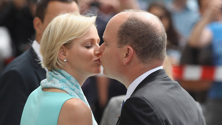 Princess Charlene and Prince Albert kiss 