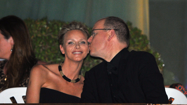 Prince Albert kisses Princess Charlene on the cheek 