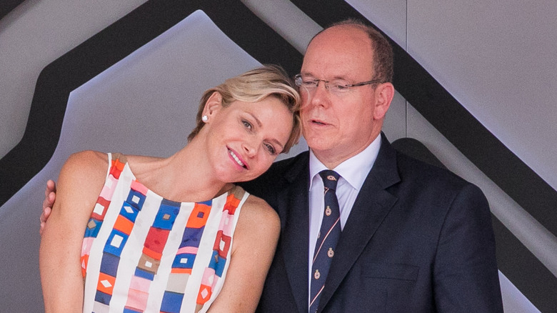 Princess Charlene and Prince Albert cuddling 