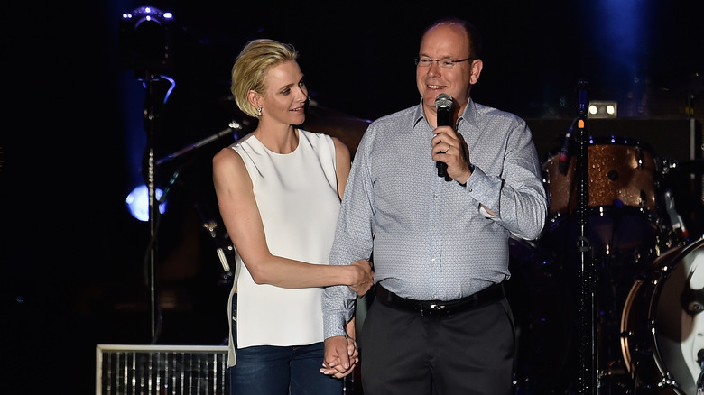 Princess Charlene and Prince Albert on stage