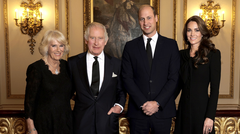 Queen Camilla, King Charles, Prince William, and Princess Catherine posing