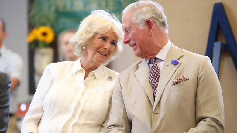 Queen Camilla and King Charles laughing