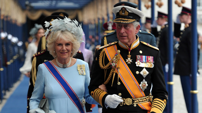 Queen Camilla and King Charles walking in procession